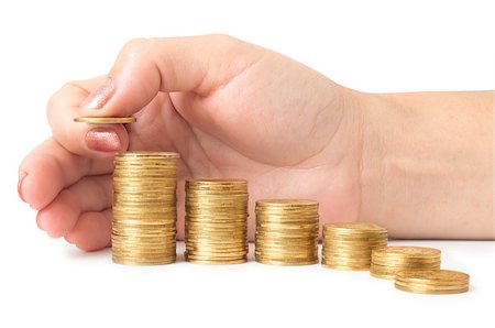 piles of cash pounds - Hand put coins to stack of coins on white background Photographie de stock - Aubaine LD & Abonnement, Code: 400-07774270