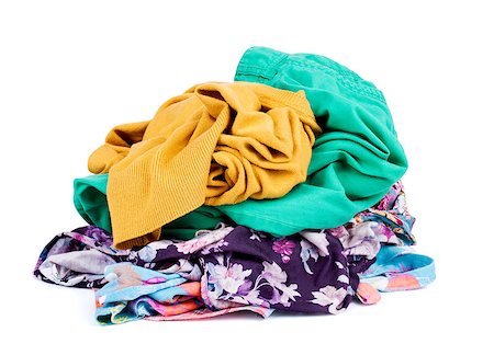 Big heap of colorful clothes, isolated on white background. Foto de stock - Super Valor sin royalties y Suscripción, Código: 400-07774308