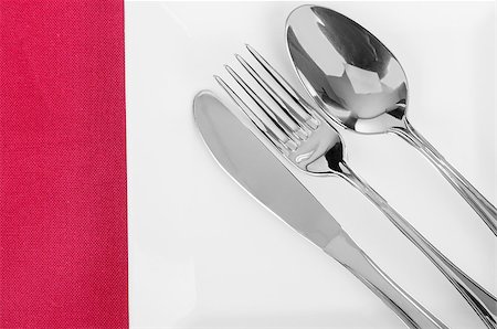 simsearch:400-08628418,k - White empty plate with fork and knife on a red tablecloth Stock Photo - Budget Royalty-Free & Subscription, Code: 400-07774366