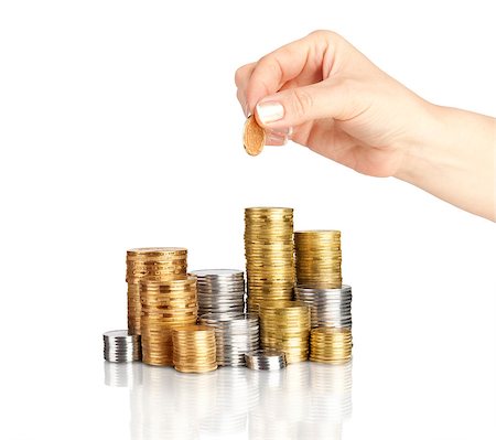 piles of cash pounds - Hand put coins to stack of coins on white background Photographie de stock - Aubaine LD & Abonnement, Code: 400-07774429