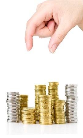 piles of cash pounds - Hand put coins to stack of coins on white background Photographie de stock - Aubaine LD & Abonnement, Code: 400-07774423