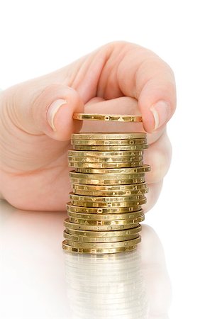 piles of cash pounds - Hand put coins to stack of coins on white background Photographie de stock - Aubaine LD & Abonnement, Code: 400-07774438