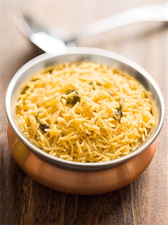 close up of a bowl of indian golden biryani rice Foto de stock - Super Valor sin royalties y Suscripción, Código: 400-07774624