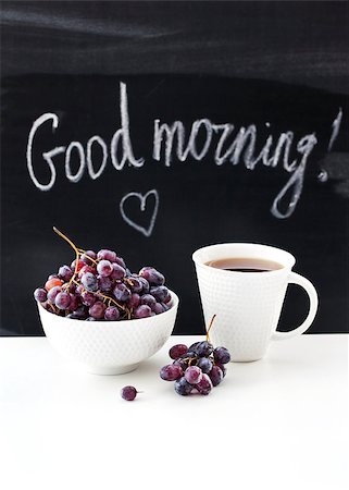 Coffee mug and fresh grape  on the table with blackboard on background Stock Photo - Budget Royalty-Free & Subscription, Code: 400-07774645