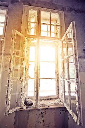 damaged factory interiors - sun shining through an old window in an abandoned building Stock Photo - Budget Royalty-Free & Subscription, Code: 400-07774674