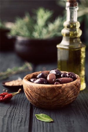 Olives with herbs. Mediterranean ingredients: rosemary, olives, thyme, sage, salt, oregano Stockbilder - Microstock & Abonnement, Bildnummer: 400-07774836