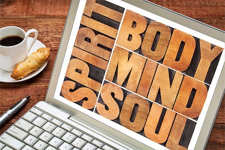simsearch:400-07179122,k - body, mind, soul and spirit word abstract - a collage of isolated text in vintage wood letterpress printing blocks on a laptop screen with a cup of coffee Stock Photo - Budget Royalty-Free & Subscription, Code: 400-07774956