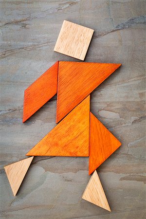 simsearch:400-07774007,k - abstract of a dancing or walking figure built from seven tangram wooden pieces, a traditional Chinese puzzle game; slate rock background background, the artwork copyright by the photographer Foto de stock - Royalty-Free Super Valor e Assinatura, Número: 400-07774960