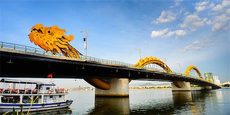 Dragon bridge cross Han river with reflection at Danang city, Vietnam in August 15th 2014 Foto de stock - Super Valor sin royalties y Suscripción, Código: 400-07776559