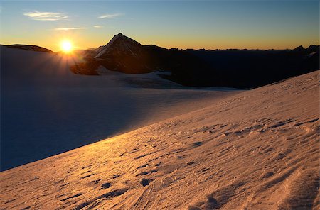 studio023 (artist) - Sunrise in high mountains above the glacier Stockbilder - Microstock & Abonnement, Bildnummer: 400-07776853
