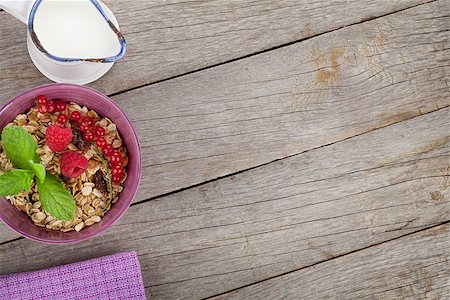 simsearch:400-04393799,k - Healty breakfast with muesli, berries and milk. View from above on wooden table with copy space Stockbilder - Microstock & Abonnement, Bildnummer: 400-07776912
