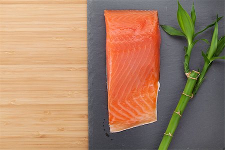 simsearch:400-08187570,k - Fresh salmon fish on bamboo wooden table with copy space Stockbilder - Microstock & Abonnement, Bildnummer: 400-07776925