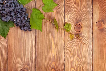 simsearch:400-08110621,k - Bunch of red grapes on wooden table background with copy space Stock Photo - Budget Royalty-Free & Subscription, Code: 400-07776972