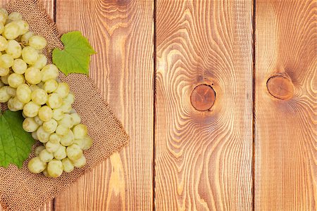 simsearch:400-08110621,k - Bunch of white grapes on wooden table background with copy space Stock Photo - Budget Royalty-Free & Subscription, Code: 400-07776981