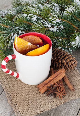 Christmas mulled wine with spices and snowy fir tree on wooden table Stock Photo - Budget Royalty-Free & Subscription, Code: 400-07777019