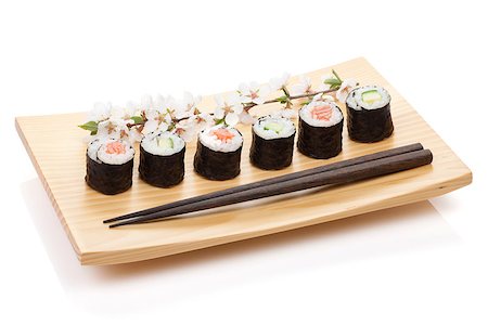 simsearch:400-08072780,k - Sushi maki set with salmon and cucumber and sakura branch. Isolated on white background Stockbilder - Microstock & Abonnement, Bildnummer: 400-07777058