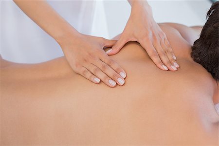 simsearch:400-07723724,k - Close up mid section of a man receiving back massage at spa center Photographie de stock - Aubaine LD & Abonnement, Code: 400-07777129