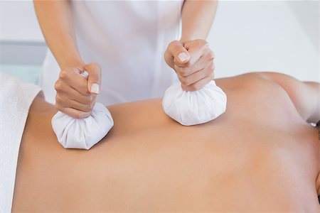 simsearch:400-07723714,k - Close up mid section of a man receiving back massage at spa center Photographie de stock - Aubaine LD & Abonnement, Code: 400-07777135