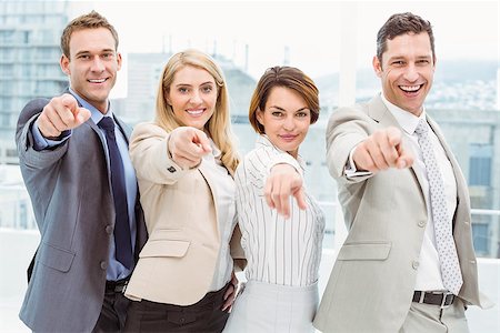 Portrait of happy business people pointing at you in the office Stock Photo - Budget Royalty-Free & Subscription, Code: 400-07777856