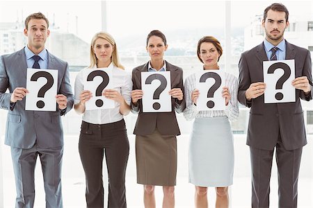 Portrait of business people holding question mark signs in office Stock Photo - Budget Royalty-Free & Subscription, Code: 400-07777887