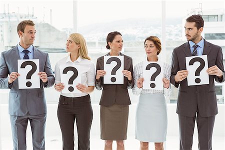 Portrait of business people holding question mark signs in office Stock Photo - Budget Royalty-Free & Subscription, Code: 400-07777888