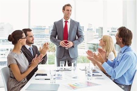 Young business people clapping hands in board room meeting at office Photographie de stock - Aubaine LD & Abonnement, Code: 400-07778087