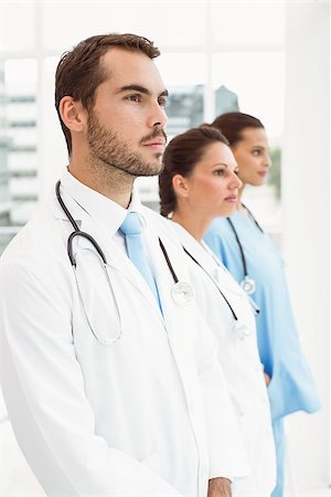 simsearch:400-07778150,k - Serious confident doctors standing at medical office Stock Photo - Budget Royalty-Free & Subscription, Code: 400-07778132