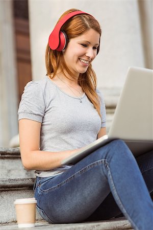 simsearch:400-06690896,k - Happy enjoying woman listening with headphones to music in the street Stock Photo - Budget Royalty-Free & Subscription, Code: 400-07778592