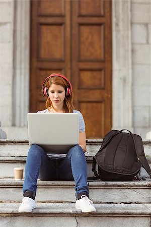simsearch:400-06690896,k - Happy enjoying woman listening with headphones to music in the street Stock Photo - Budget Royalty-Free & Subscription, Code: 400-07778593