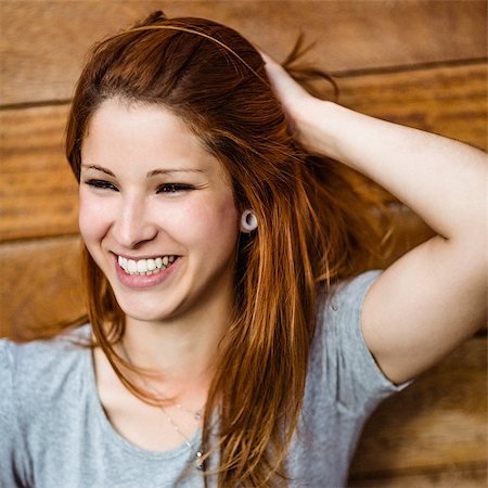 simsearch:400-07778671,k - Portrait of a cheerful pretty redhead laughing in the city Fotografie stock - Microstock e Abbonamento, Codice: 400-07778651