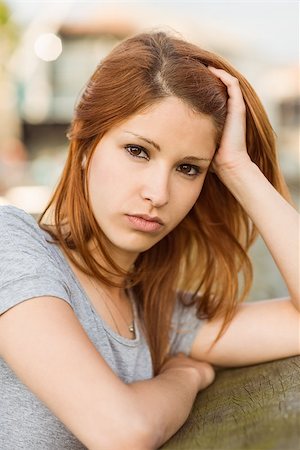 simsearch:649-06622240,k - Sad redhead frowning at camera in the city Photographie de stock - Aubaine LD & Abonnement, Code: 400-07778671