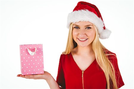 Festive blonde holding a gift bag on white background Stock Photo - Budget Royalty-Free & Subscription, Code: 400-07778984