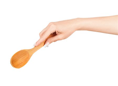 Woman hand with wooden spoon isolated on white background Stock Photo - Budget Royalty-Free & Subscription, Code: 400-07779499