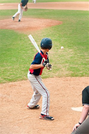 Teen baseball boy at the plate watching the ball. Stock Photo - Budget Royalty-Free & Subscription, Code: 400-07771239