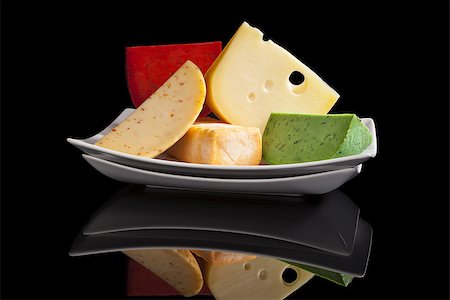emmentaler cheese - Colorful culinary cheese variation on black background. Gourmet cheese eating, modern minimal contemporary style. Stock Photo - Budget Royalty-Free & Subscription, Code: 400-07771406