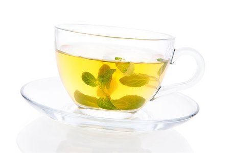 simsearch:400-07772886,k - Fresh mint tea. Peppermint leafes in transparent teacup isolated on white with clipping path. Healthy tea drinking. Stock Photo - Budget Royalty-Free & Subscription, Code: 400-07771423