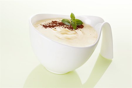 simsearch:400-08034414,k - Delicious vanilla pudding with fresh mint and cocoa powder in white bowl isolated. Culinary sweet eating. Stock Photo - Budget Royalty-Free & Subscription, Code: 400-07771433