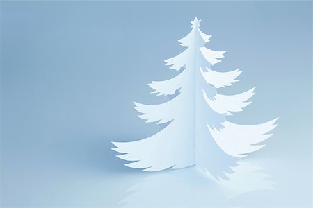 Handmade paper cut Christmas tree on cold white background - horizontal Stock Photo - Budget Royalty-Free & Subscription, Code: 400-07772076