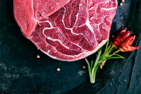 simsearch:652-03803644,k - Meat. Raw meat. Beef steak on  black with herbs Stock Photo - Budget Royalty-Free & Subscription, Code: 400-07772183