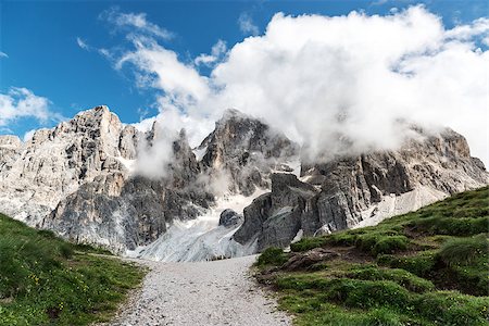 Dolomites, Pale di San Martino landscape in summer season with clouds - Italy Foto de stock - Royalty-Free Super Valor e Assinatura, Número: 400-07772301