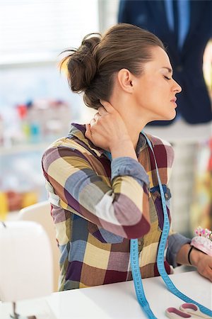 Portrait of tired tailor woman with neck pain Stock Photo - Budget Royalty-Free & Subscription, Code: 400-07772354