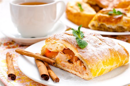 preparation of apple pie - slice of an apple strudel with tea Stock Photo - Budget Royalty-Free & Subscription, Code: 400-07772515