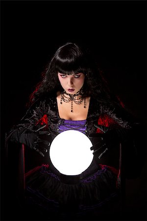 simsearch:400-07776243,k - Beautiful witch or fortune teller with a crystal ball, Halloween theme Fotografie stock - Microstock e Abbonamento, Codice: 400-07772554