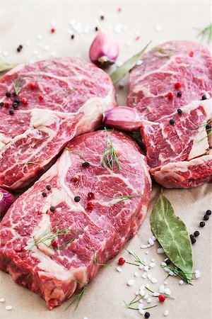 simsearch:652-03803644,k - Raw beef ribeye steak on a baking paper, ready to cook Stock Photo - Budget Royalty-Free & Subscription, Code: 400-07772608