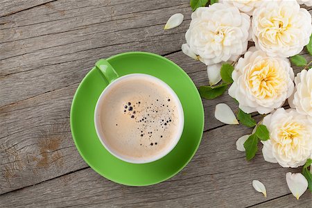Coffee cup and white rose flowers on wooden table background Stock Photo - Budget Royalty-Free & Subscription, Code: 400-07773133