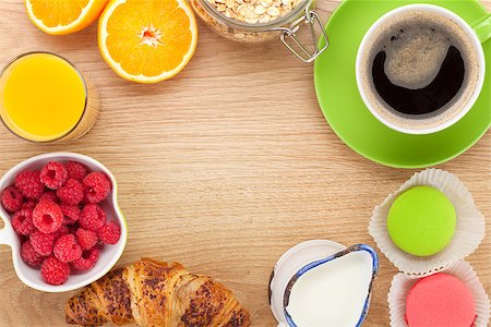 porridge and berries - Healty breakfast with muesli, berries, orange juice, coffee and croissant. View from above on wooden table with copy space Stock Photo - Budget Royalty-Free & Subscription, Code: 400-07773140