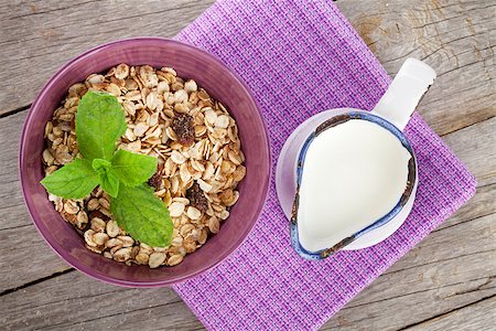 simsearch:400-08113690,k - Healty breakfast with muesli and milk. View from above on wooden table Stock Photo - Budget Royalty-Free & Subscription, Code: 400-07773152