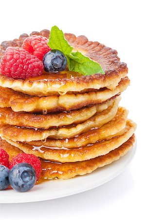 simsearch:400-09019412,k - Pancakes with raspberry, blueberry, mint and honey syrup. Isolated on white background Foto de stock - Super Valor sin royalties y Suscripción, Código: 400-07773191