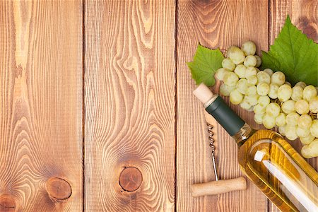 simsearch:400-08110621,k - White wine bottle and bunch of white grapes on wooden table background with copy space Stock Photo - Budget Royalty-Free & Subscription, Code: 400-07773237