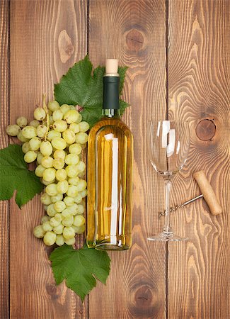 simsearch:400-08110621,k - White wine bottle and bunch of grapes on wooden table background Stock Photo - Budget Royalty-Free & Subscription, Code: 400-07773231